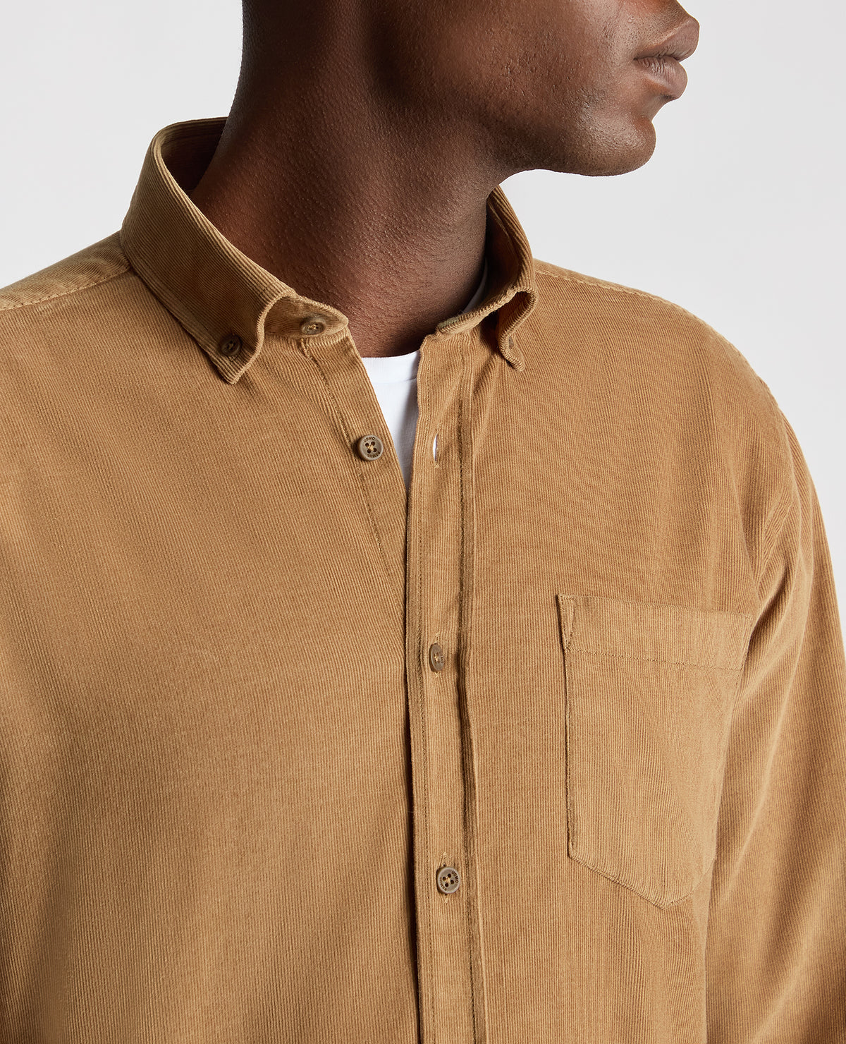 Man wearing a brown Tapered Fit Micro Corduroy Shirt