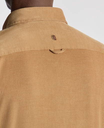 Man wearing a brown Tapered Fit Micro Corduroy Shirt