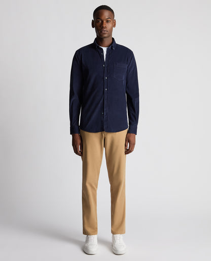 Man wearing a navy Tapered Fit Micro Corduroy Shirt