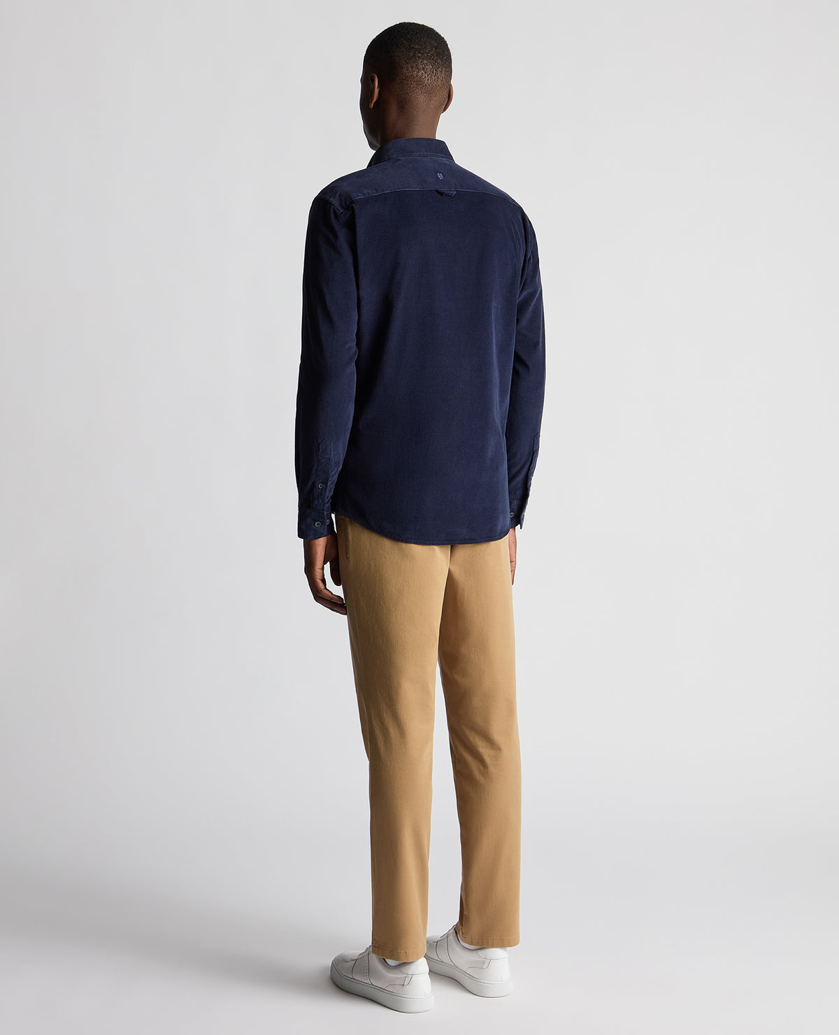 Man wearing a navy Tapered Fit Micro Corduroy Shirt