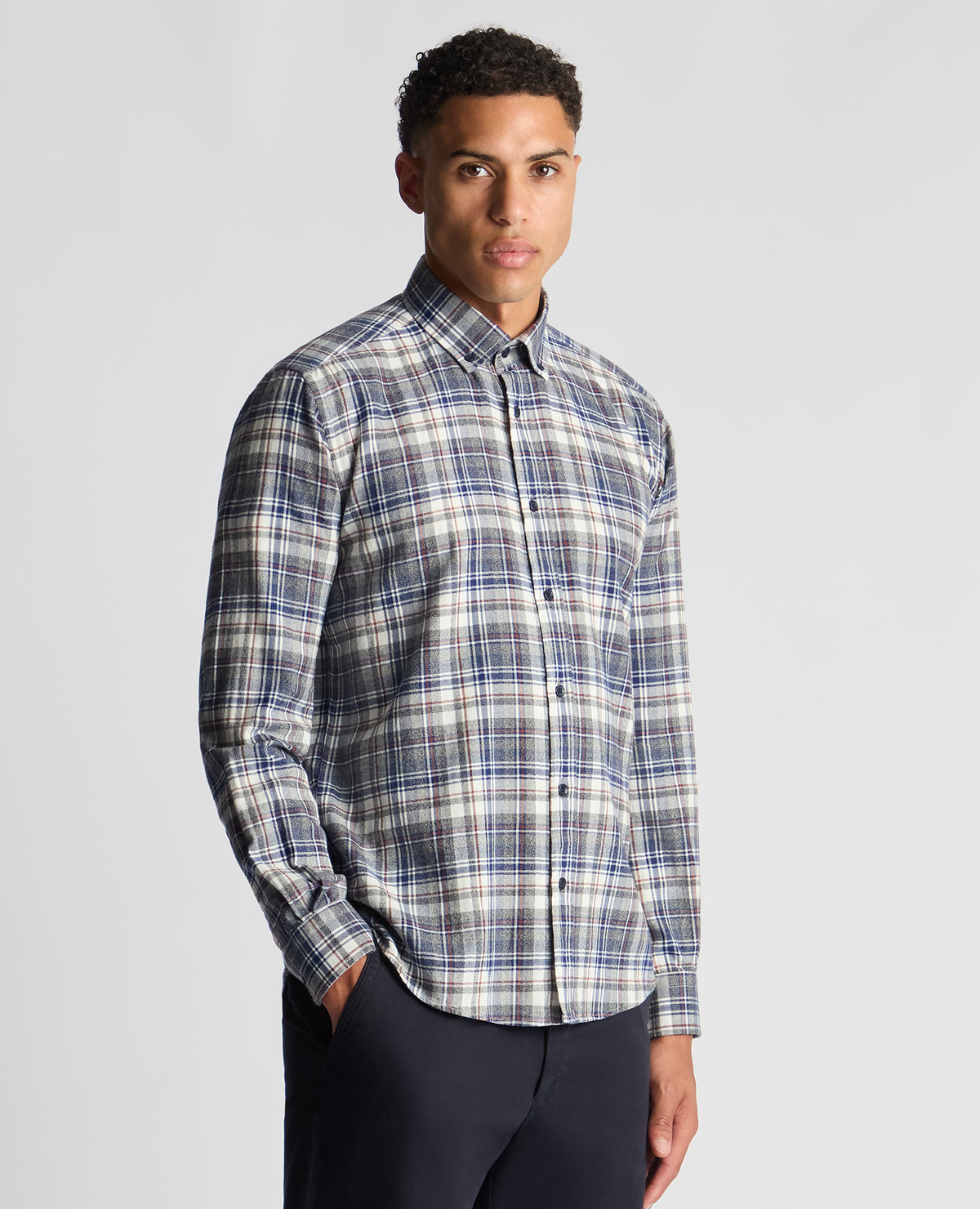 Man wearing a blue Tapered Fit Checked Brushed Cotton Shirt