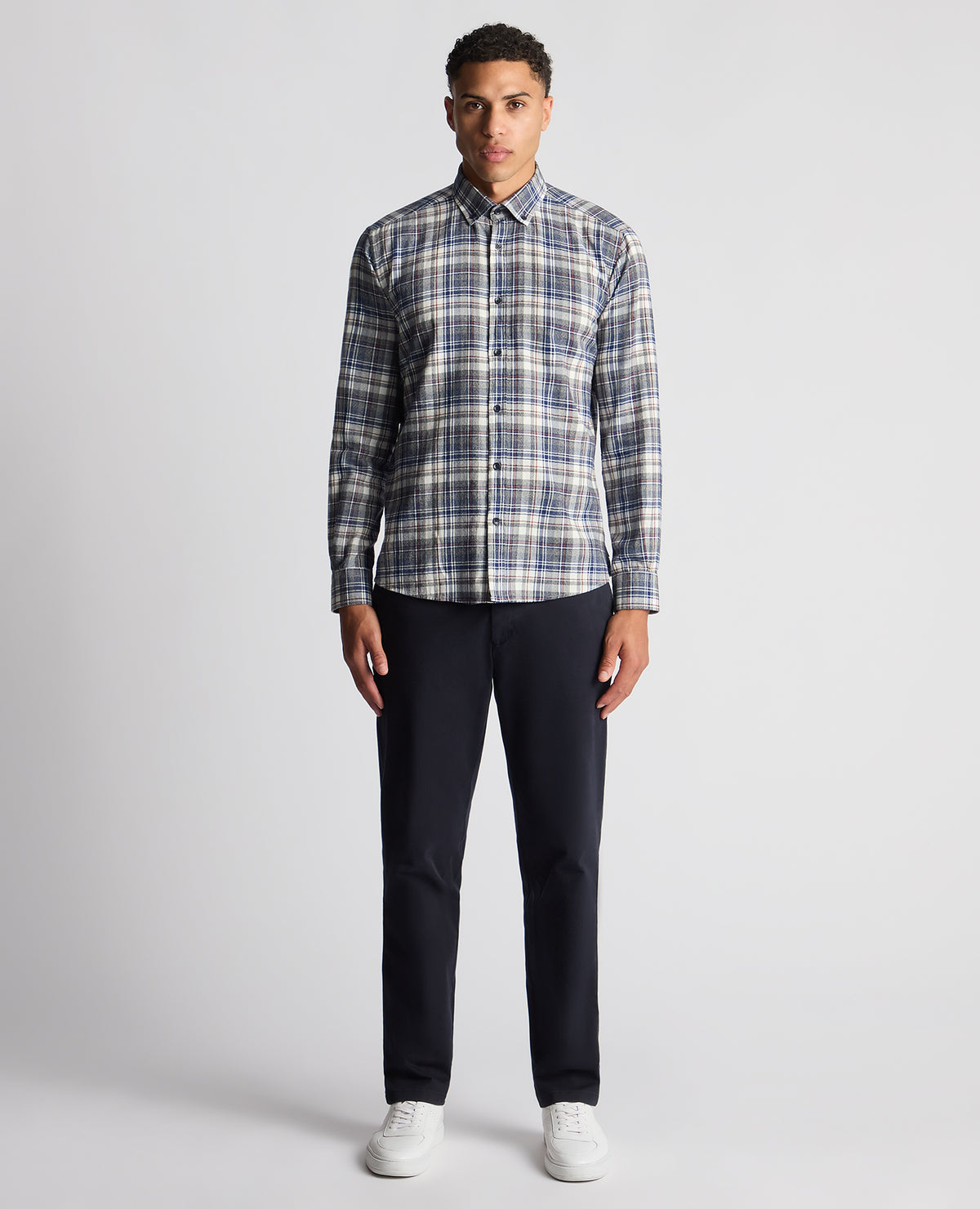 Man wearing a blue Tapered Fit Checked Brushed Cotton Shirt