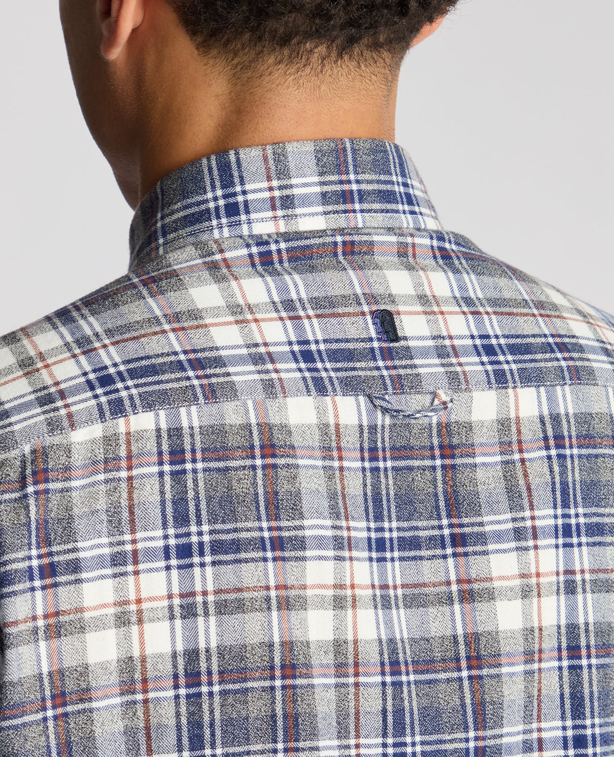 Man wearing a blue Tapered Fit Checked Brushed Cotton Shirt