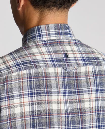 Man wearing a blue Tapered Fit Checked Brushed Cotton Shirt