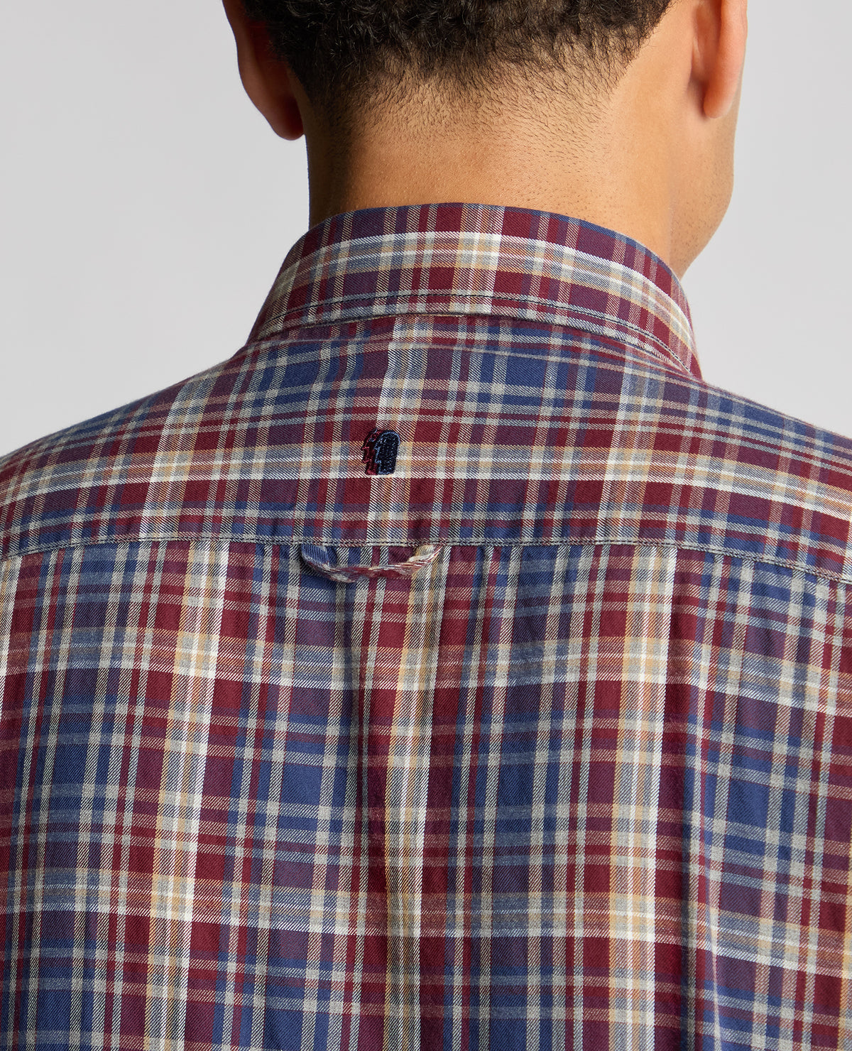 Man wearing a red Tapered Fit Checked Cotton Shirt