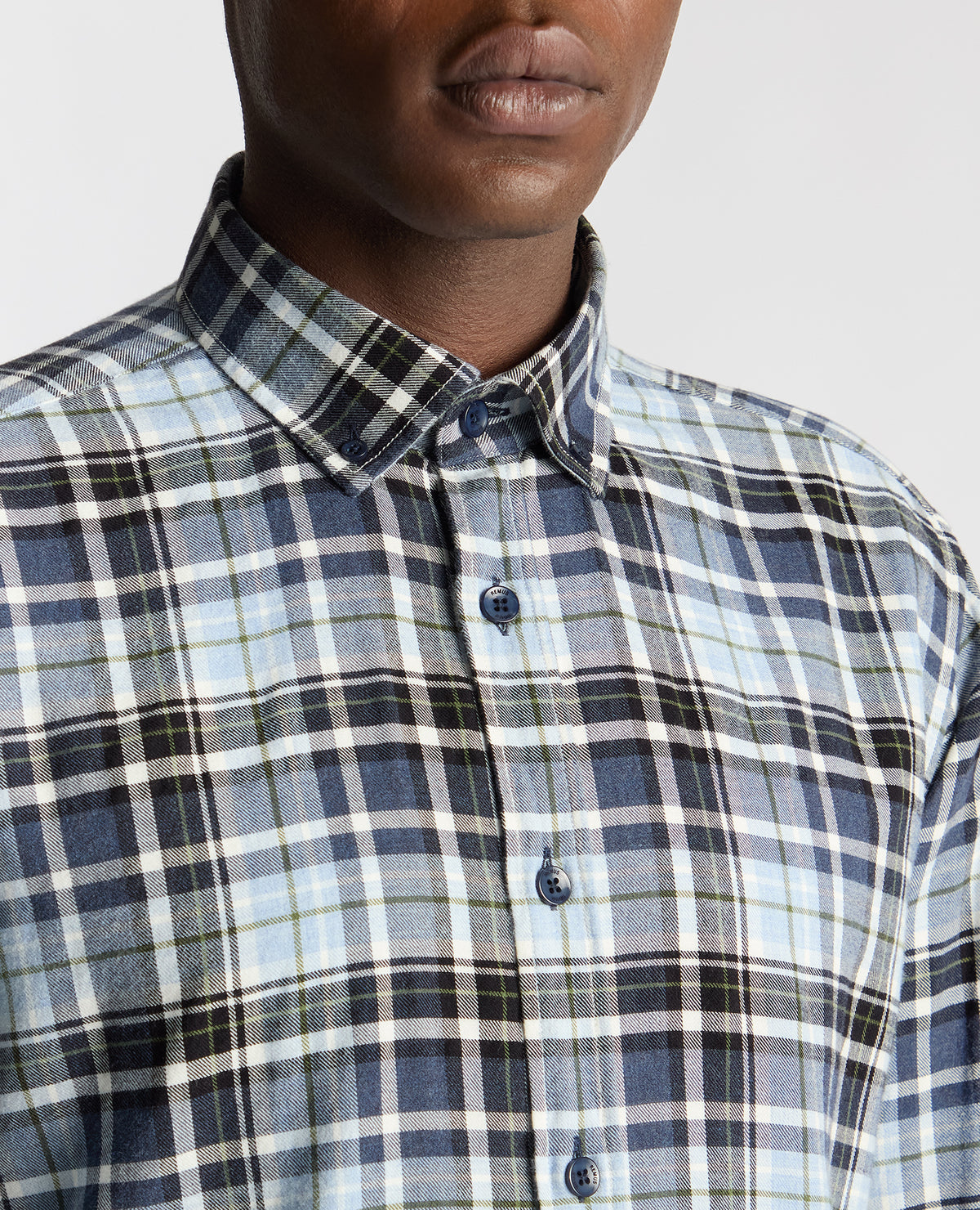 Man wearing a blue Tapered Fit Checked Cotton Shirt