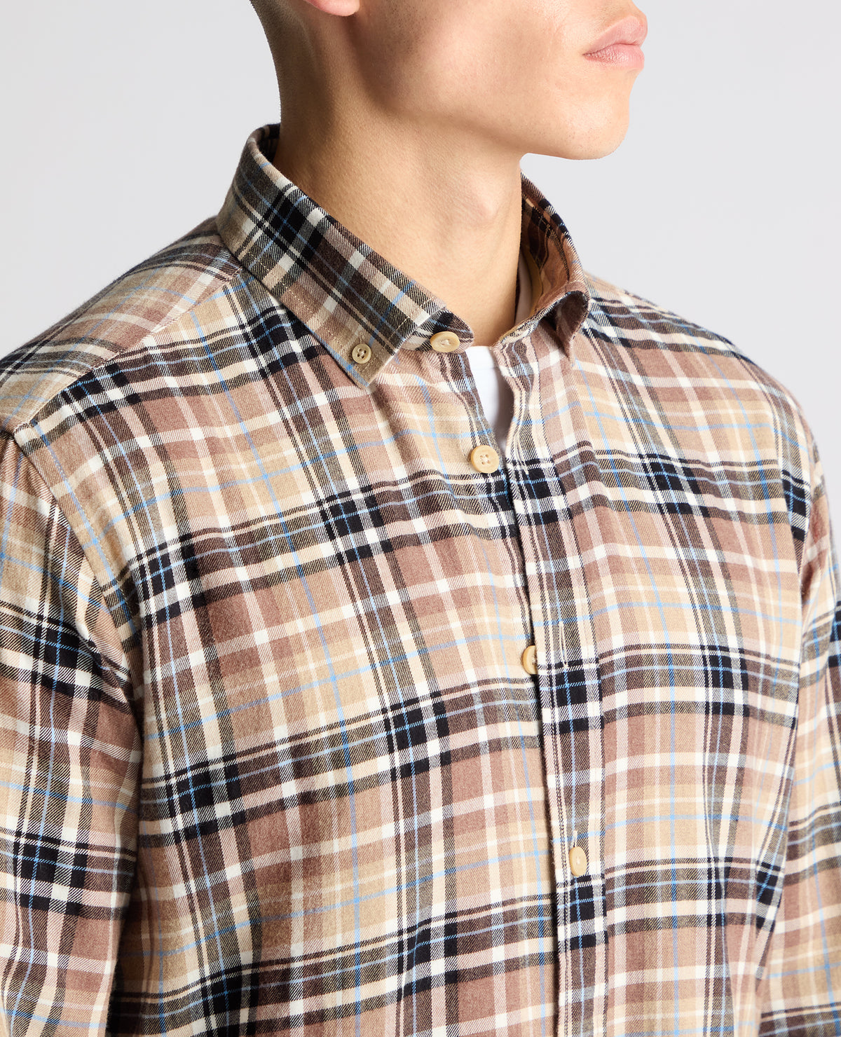 Man wearing a brown casual shirt