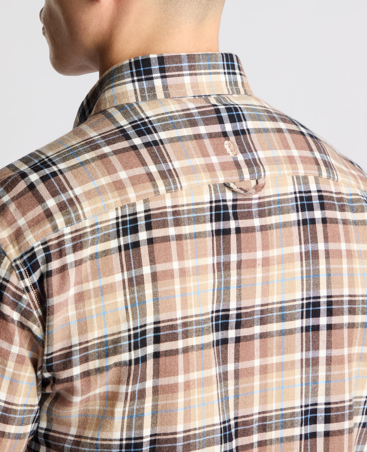 Man wearing a brown casual shirt