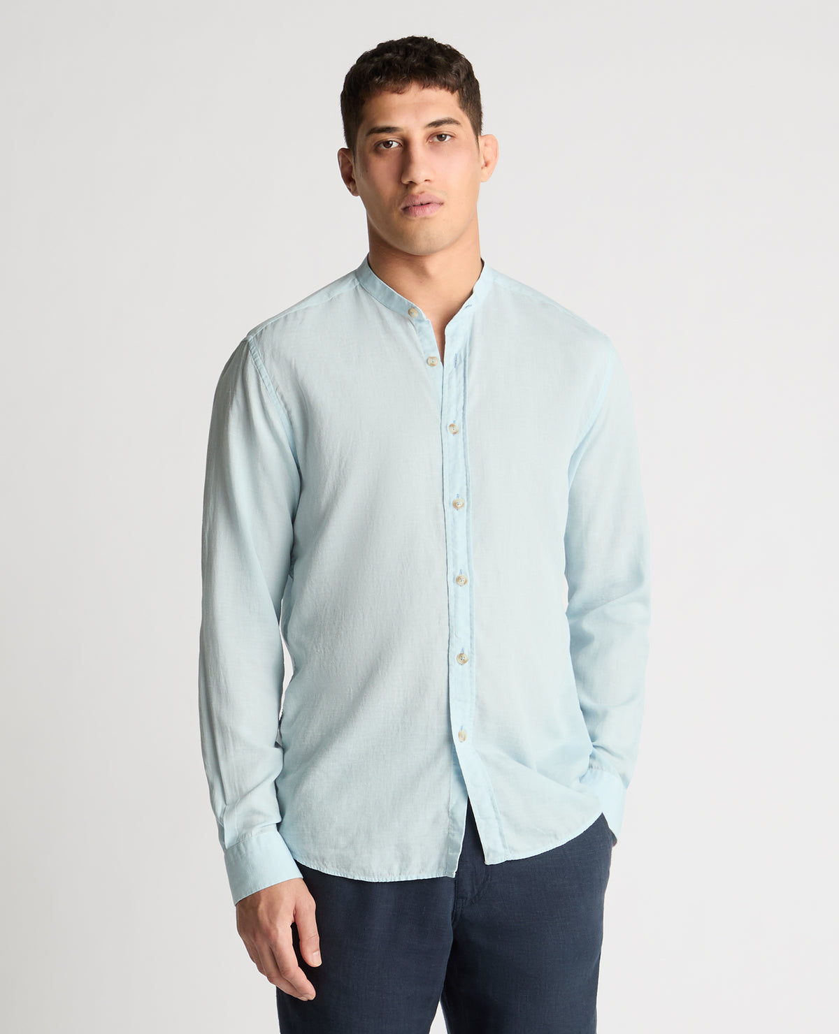 Man wearing a blue casual shirt