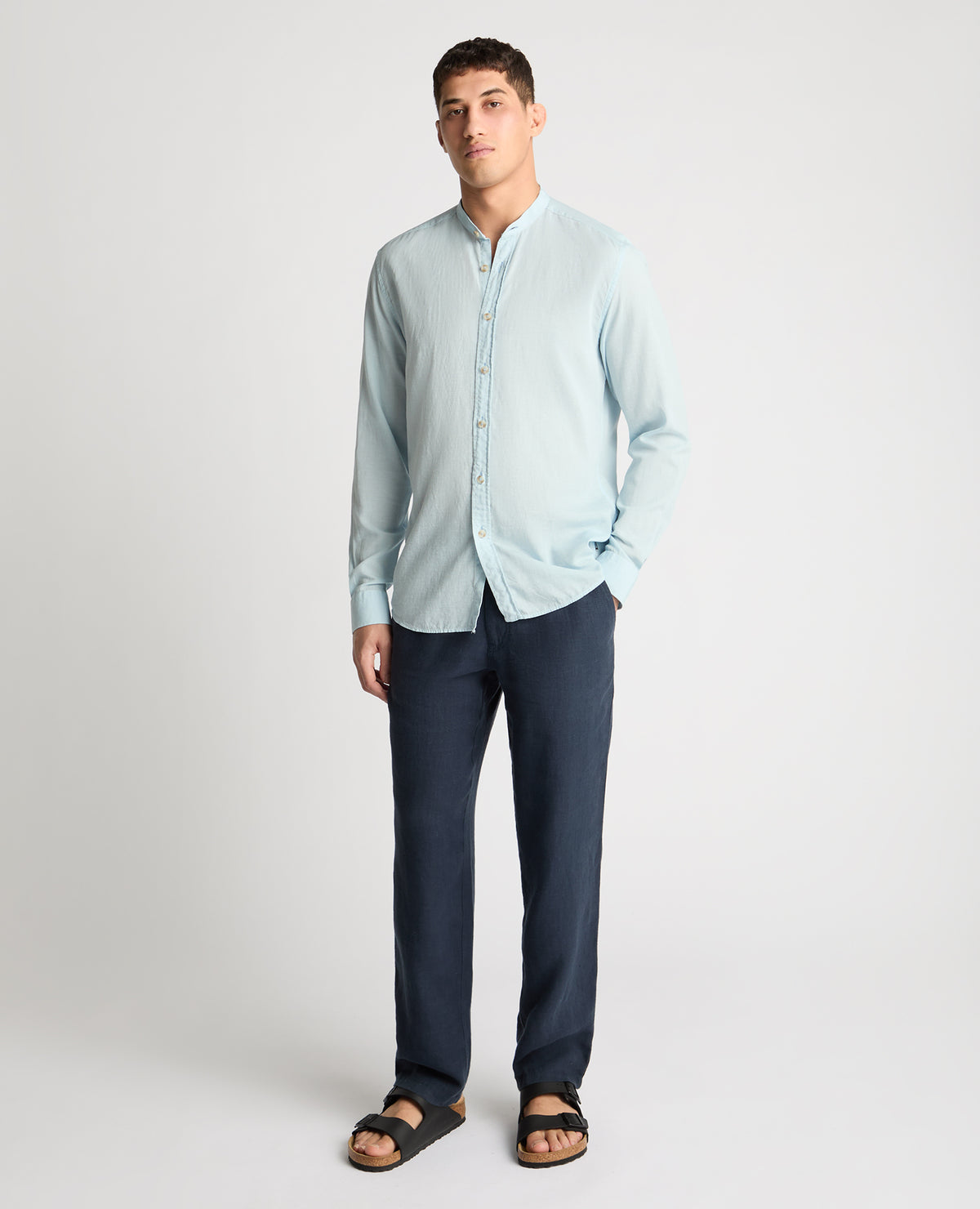 Man wearing a blue casual shirt