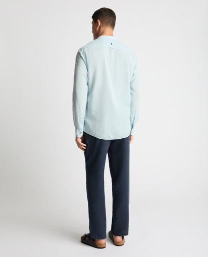 Man wearing a blue casual shirt