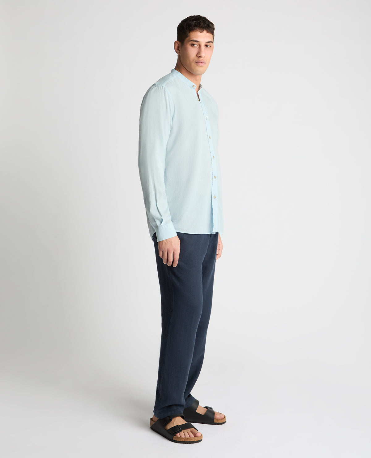 Man wearing a blue casual shirt