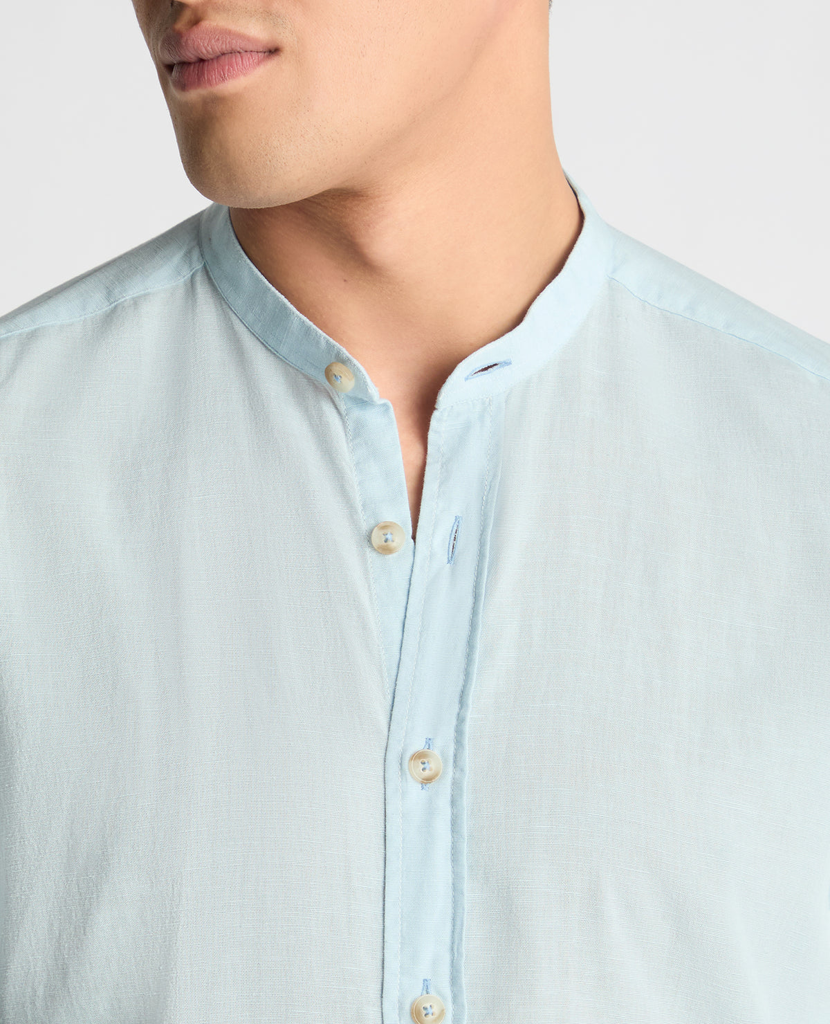 Man wearing a blue casual shirt