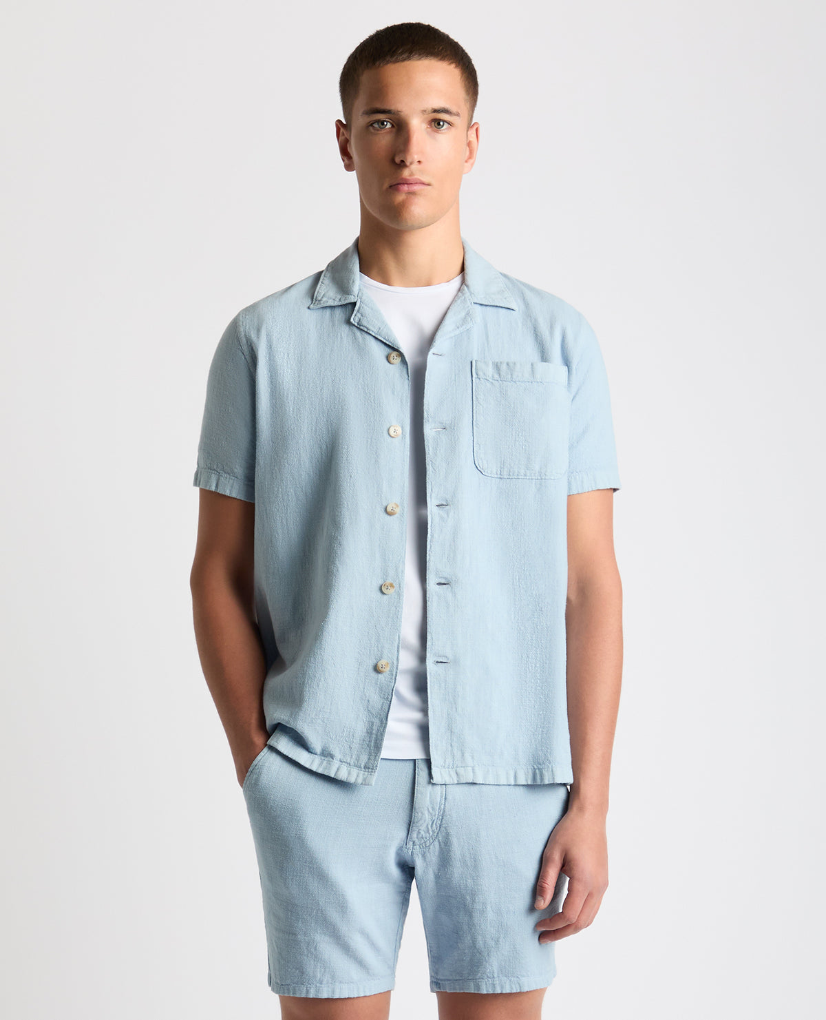 Man wearing a blue Tapered Fit Cotton-Linen Shirt