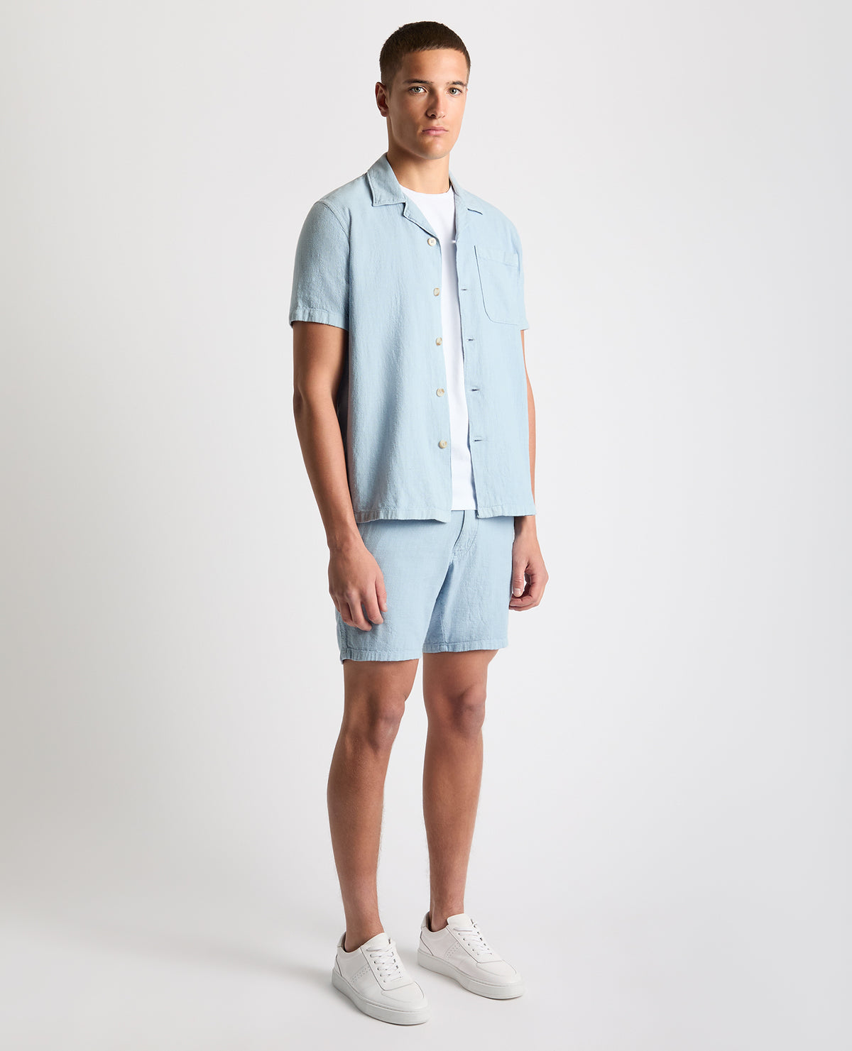Man wearing a blue Tapered Fit Cotton-Linen Shirt