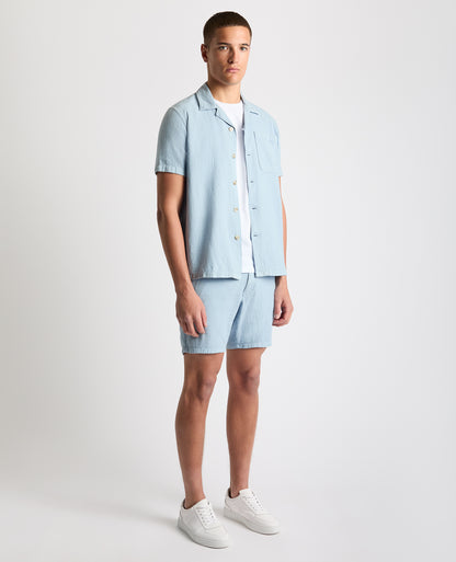 Man wearing a blue Tapered Fit Cotton-Linen Shirt