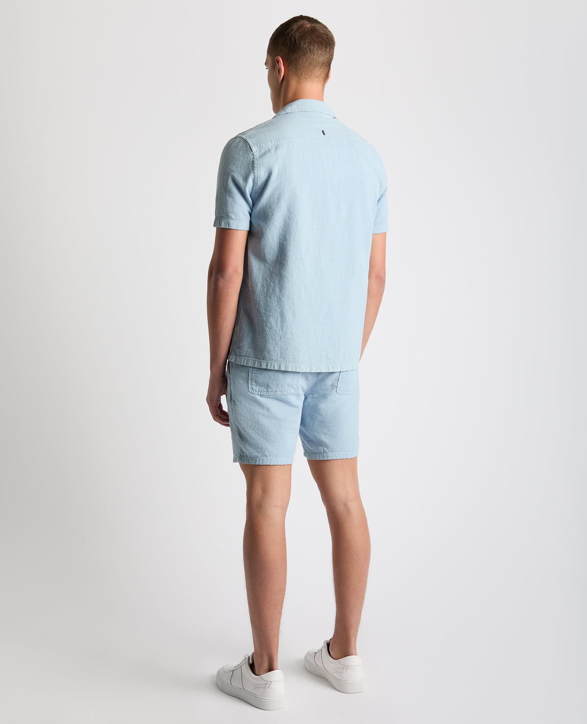 Man wearing a blue Tapered Fit Cotton-Linen Shirt