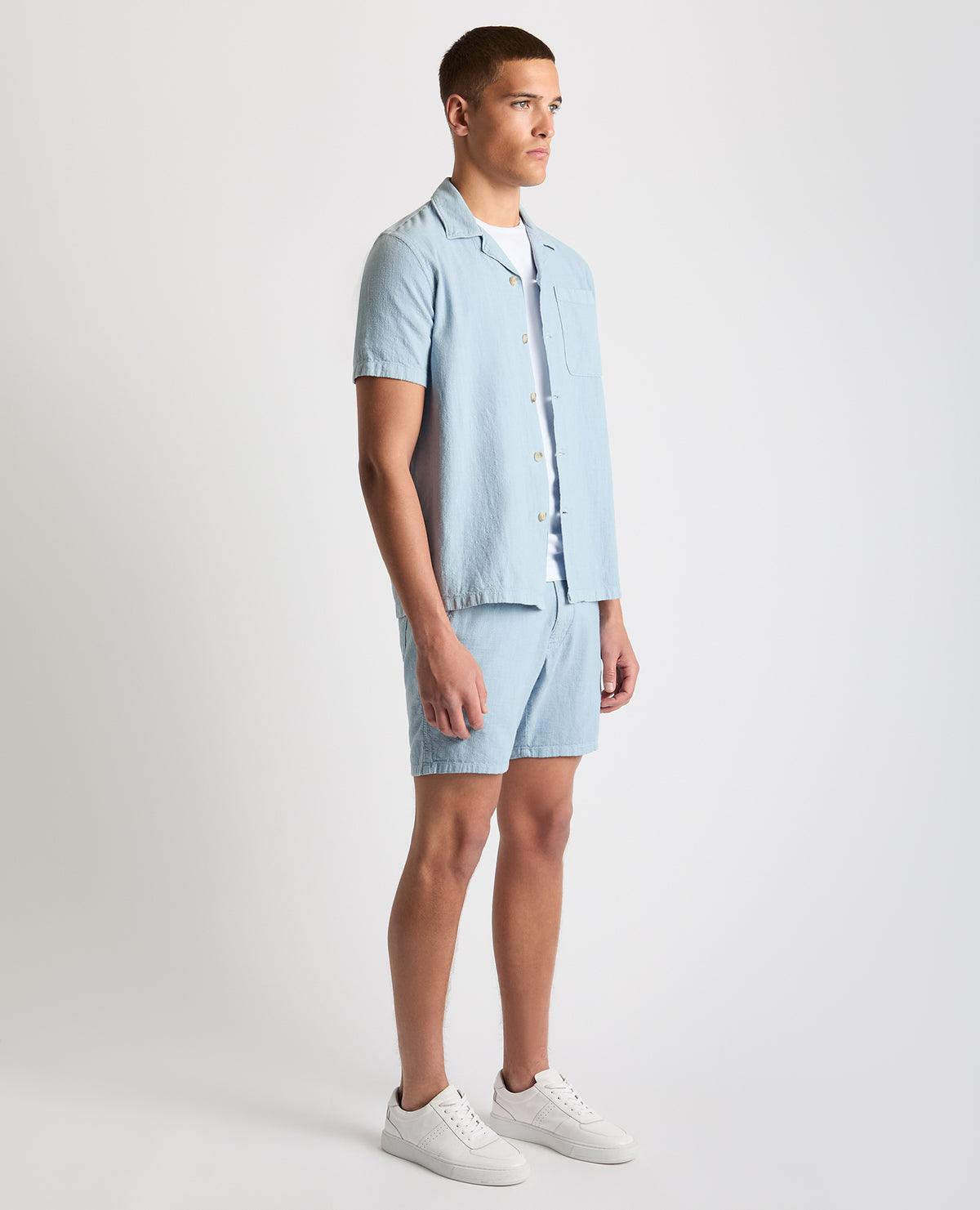 Man wearing a blue Tapered Fit Cotton-Linen Shirt