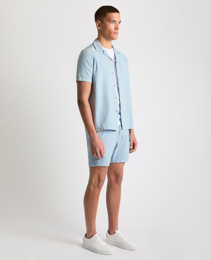 Man wearing a blue Tapered Fit Cotton-Linen Shirt