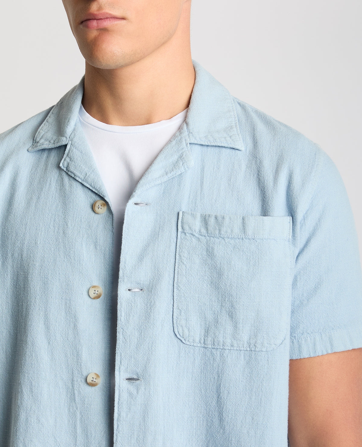 Man wearing a blue Tapered Fit Cotton-Linen Shirt