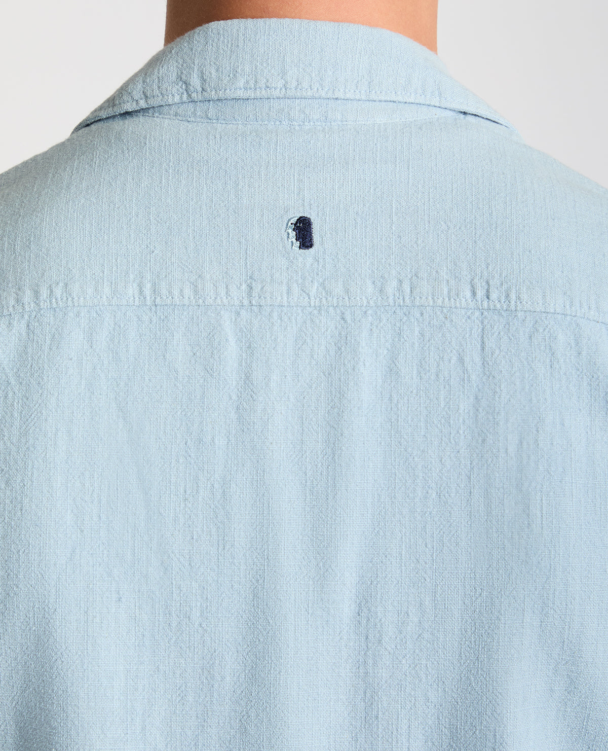 Man wearing a blue Tapered Fit Cotton-Linen Shirt
