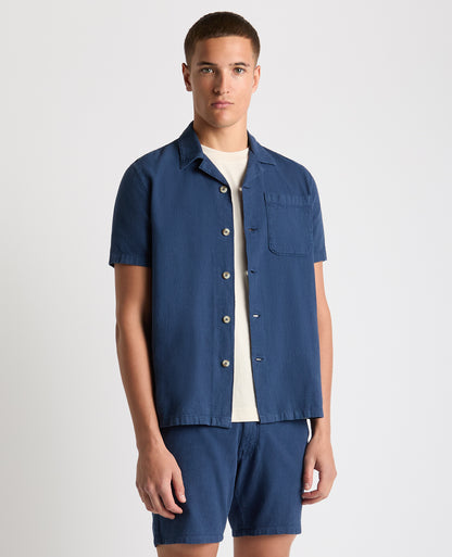Man wearing a blue Tapered Fit Cotton-Linen Shirt