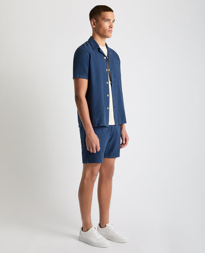 Man wearing a blue Tapered Fit Cotton-Linen Shirt