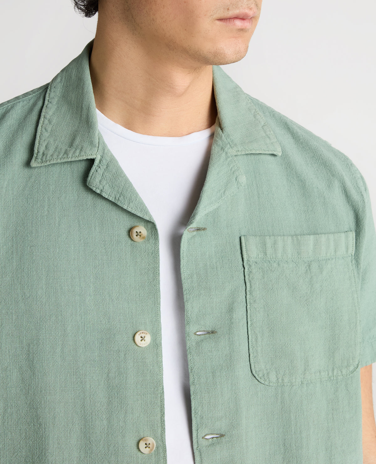 Man wearing a green Tapered Fit Cotton-Linen Shirt