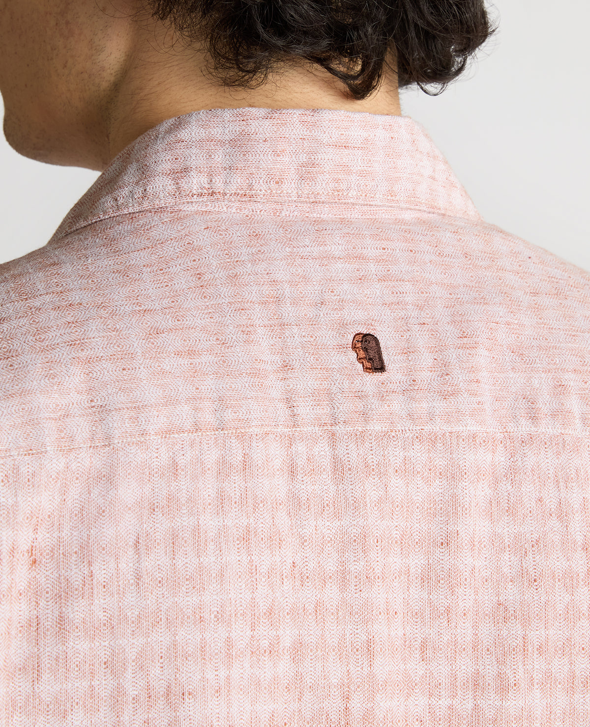 Man wearing a orange Tapered Fit Cotton-Linen Short Sleeve Shirt