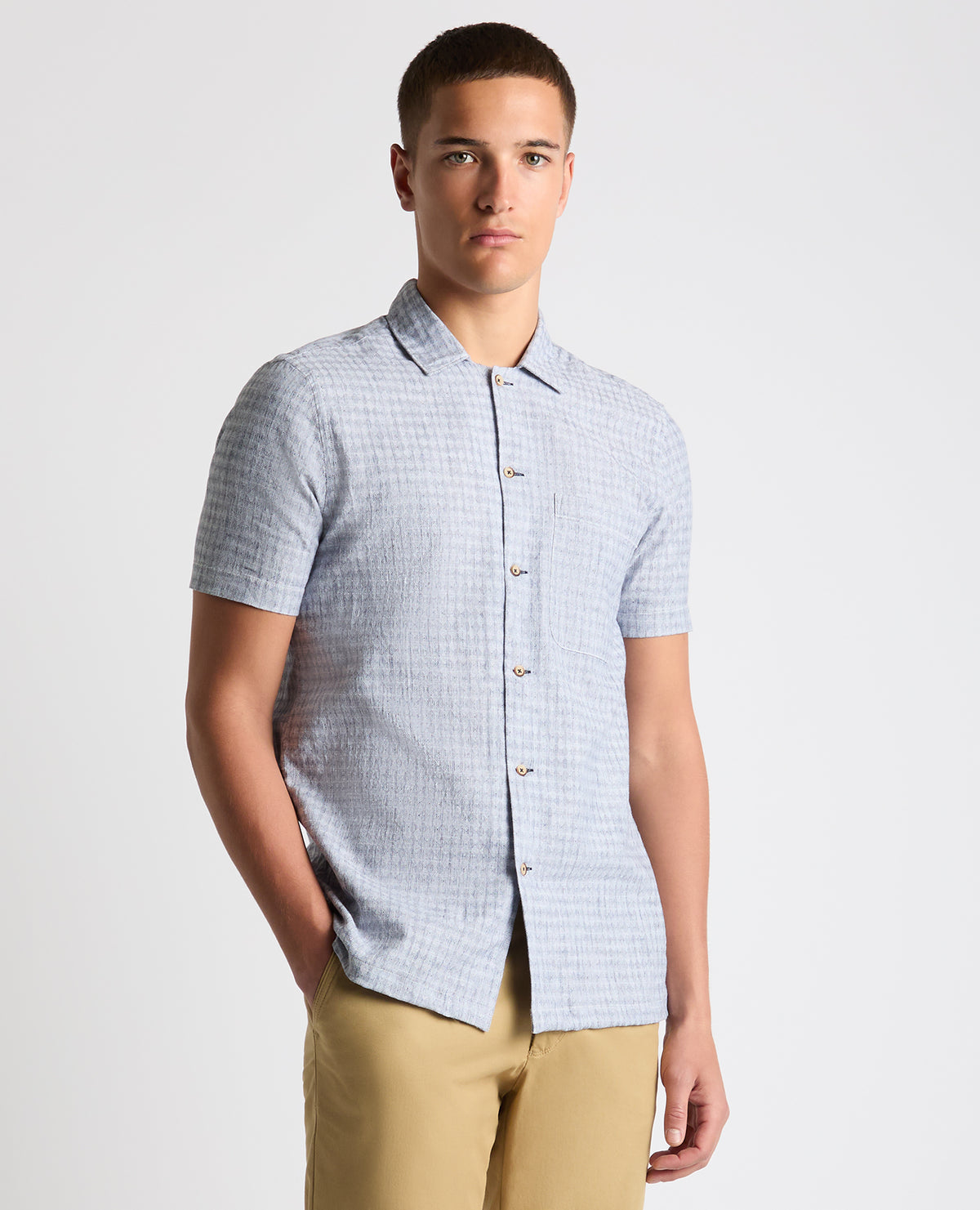 Man wearing a blue Tapered Fit Cotton-Linen Short Sleeve Shirt