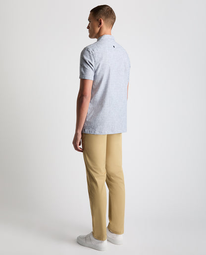 Man wearing a blue Tapered Fit Cotton-Linen Short Sleeve Shirt