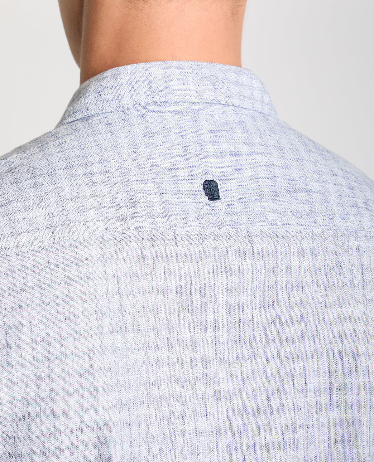 Man wearing a blue Tapered Fit Cotton-Linen Short Sleeve Shirt
