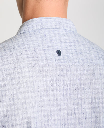 Man wearing a blue Tapered Fit Cotton-Linen Short Sleeve Shirt