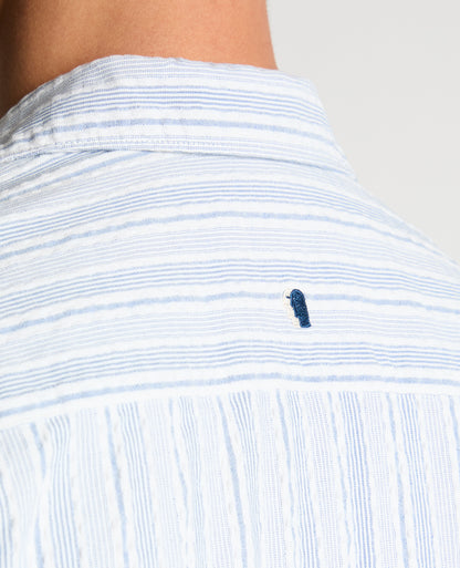 Man wearing a blue Tapered Fit Striped Seersucker Shirt