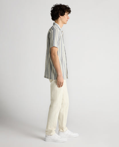 Man wearing a navy Tapered Fit Woven Cotton Striped Shirt