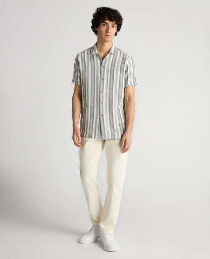 Man wearing a navy Tapered Fit Woven Cotton Striped Shirt