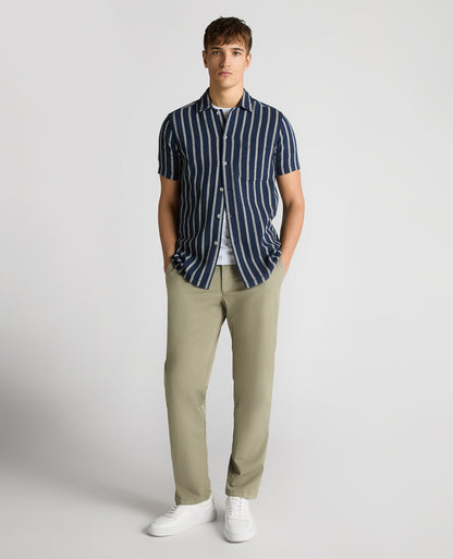 Man wearing a navy Tapered Fit Striped Cotton-Blend Shirt