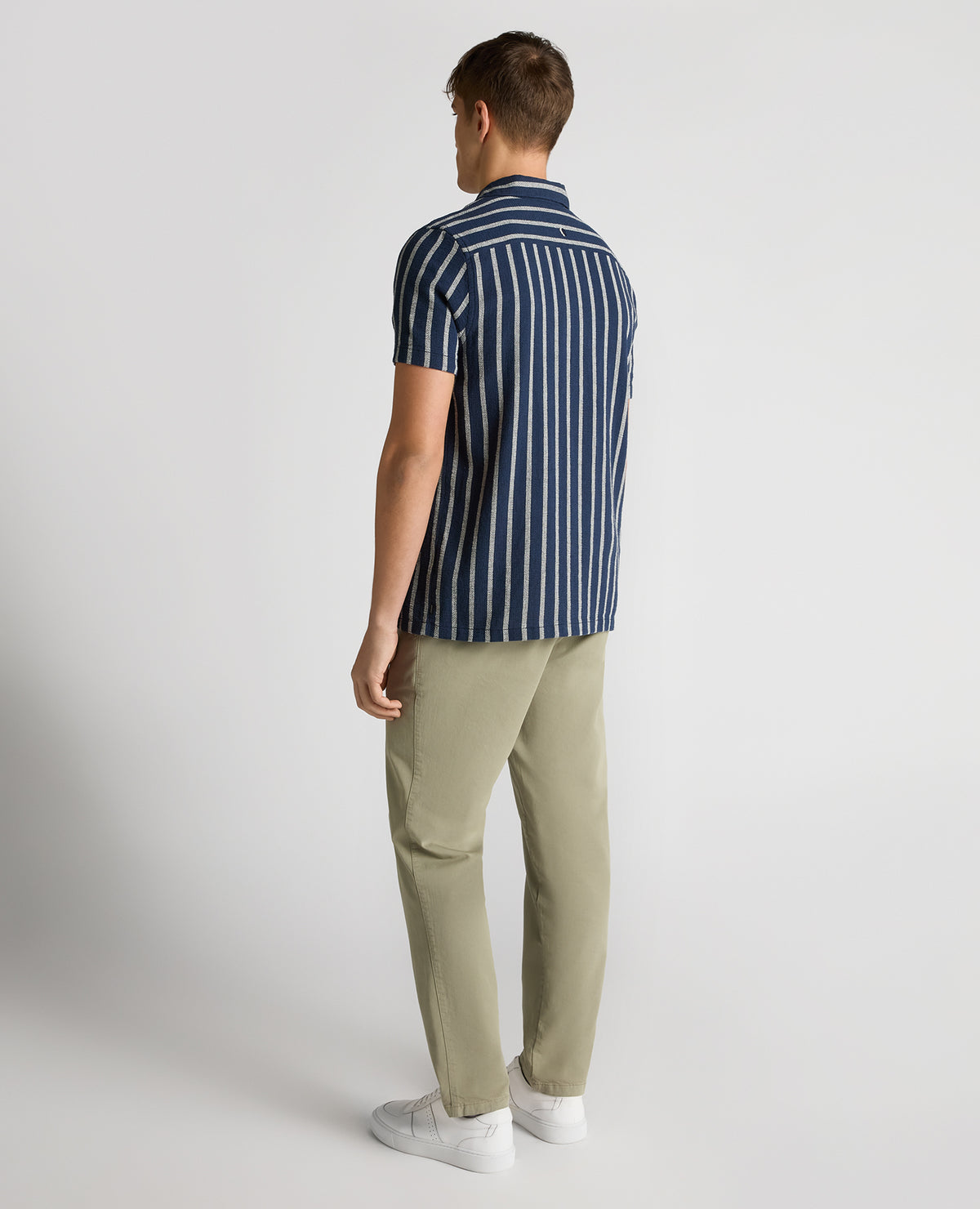 Man wearing a navy Tapered Fit Striped Cotton-Blend Shirt