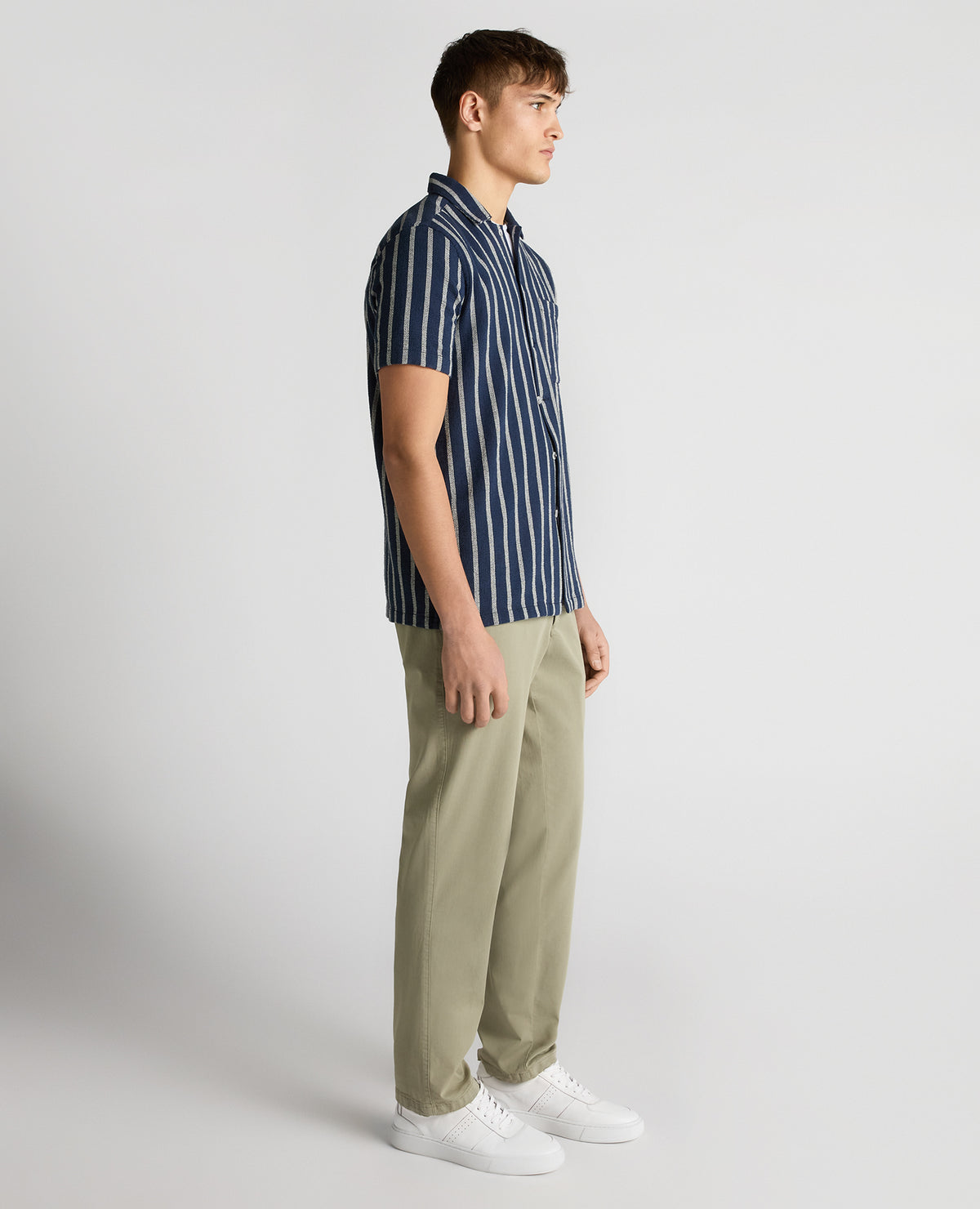 Man wearing a navy Tapered Fit Striped Cotton-Blend Shirt