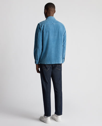 Man wearing a blue Tapered Fit Corduroy Overshirt