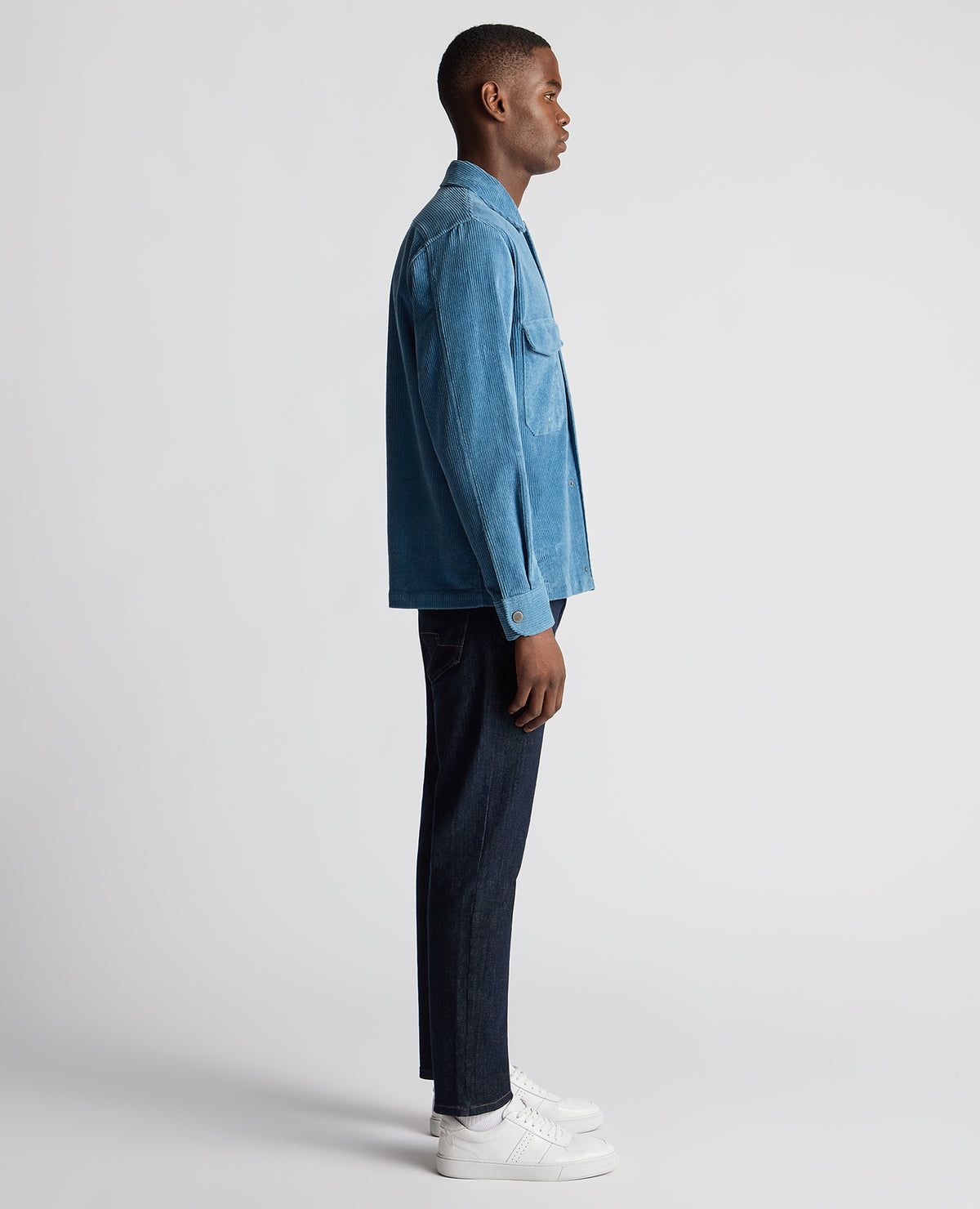 Man wearing a blue Tapered Fit Corduroy Overshirt