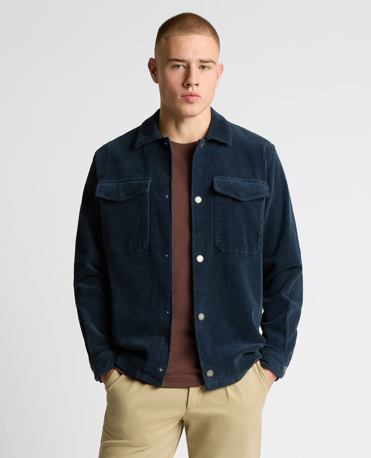 Man wearing a blue casual shirt