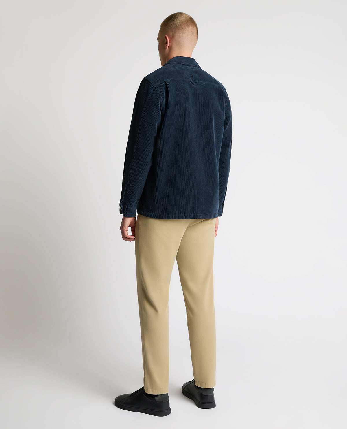 Man wearing a blue casual shirt