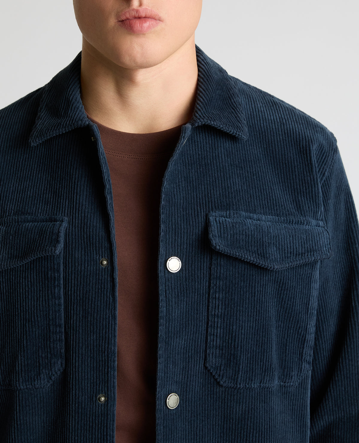 Man wearing a blue casual shirt