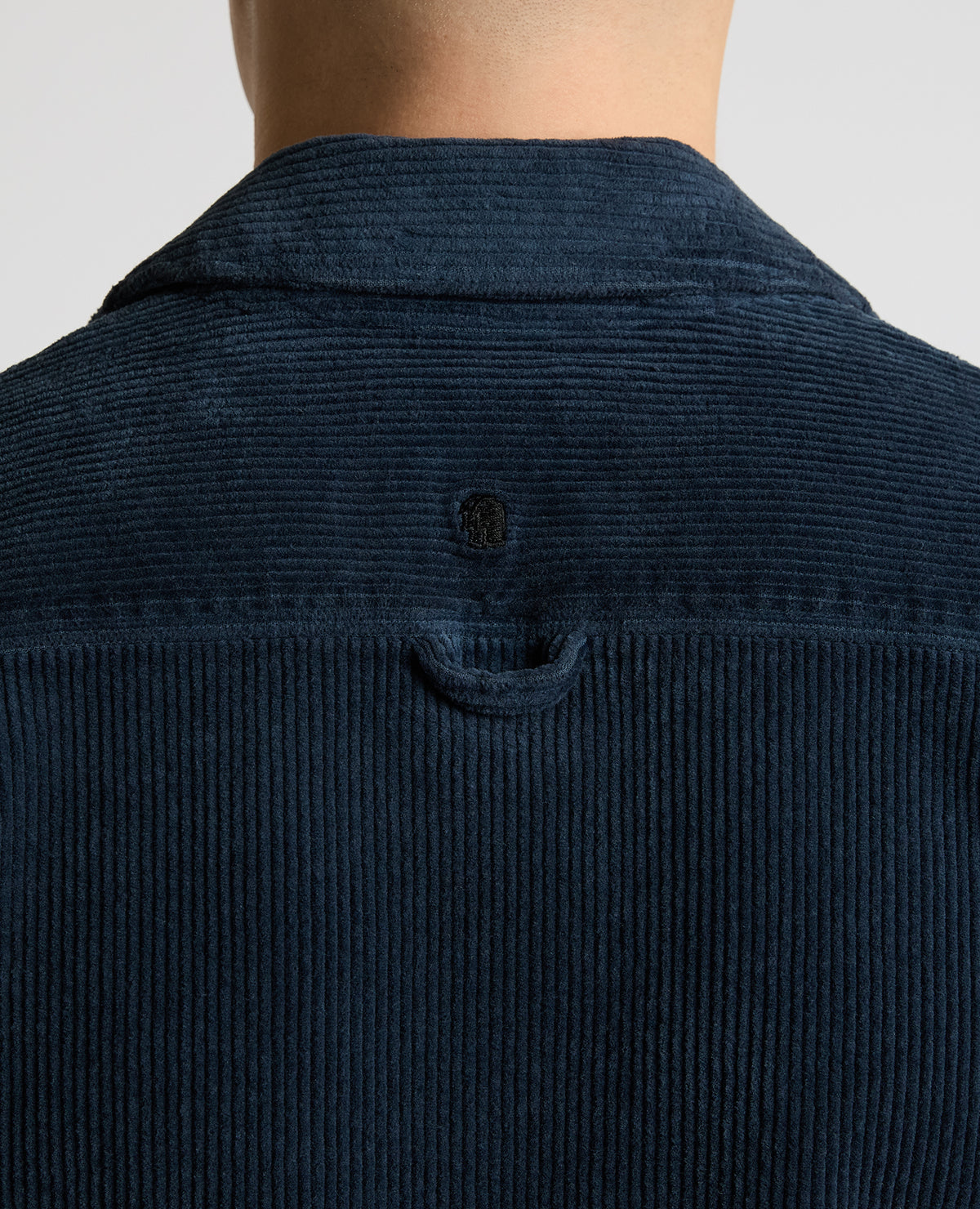Man wearing a blue casual shirt
