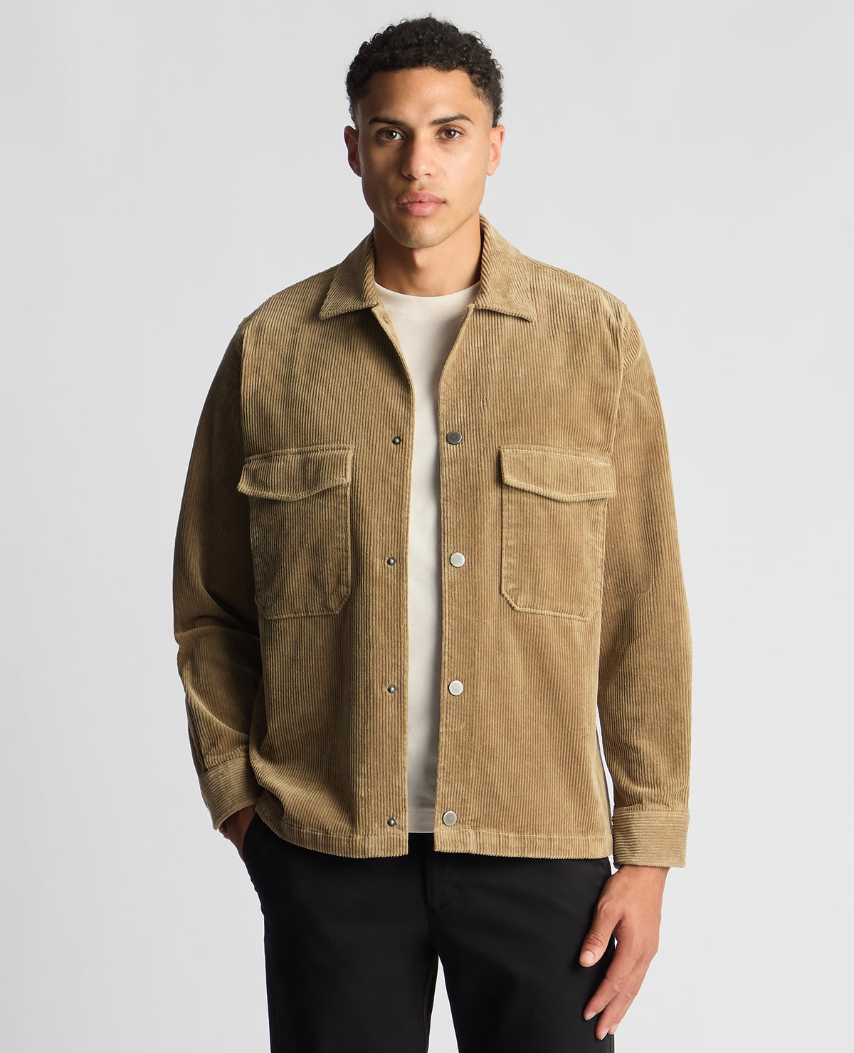 Man wearing a sand Tapered Fit Corduroy Overshirt