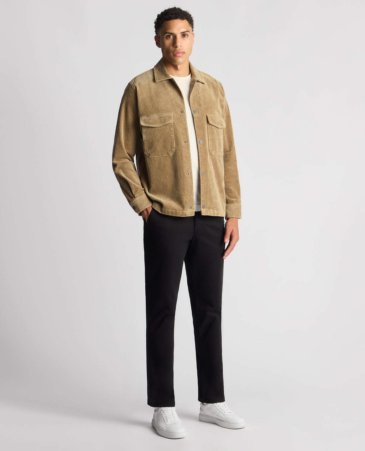 Man wearing a sand Tapered Fit Corduroy Overshirt