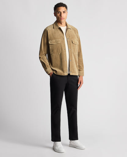 Man wearing a sand Tapered Fit Corduroy Overshirt