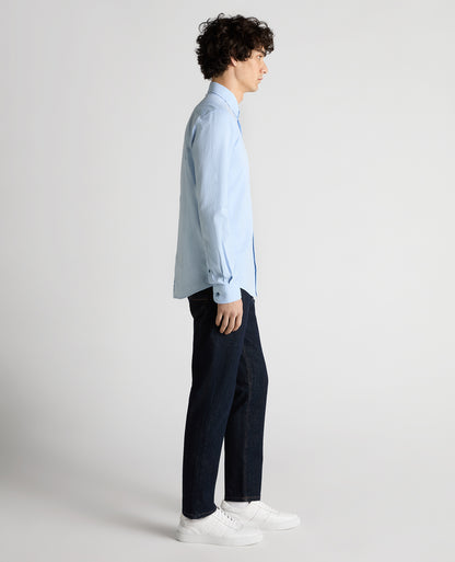 Man wearing a blue Slim Fit Cotton Oxford Shirt