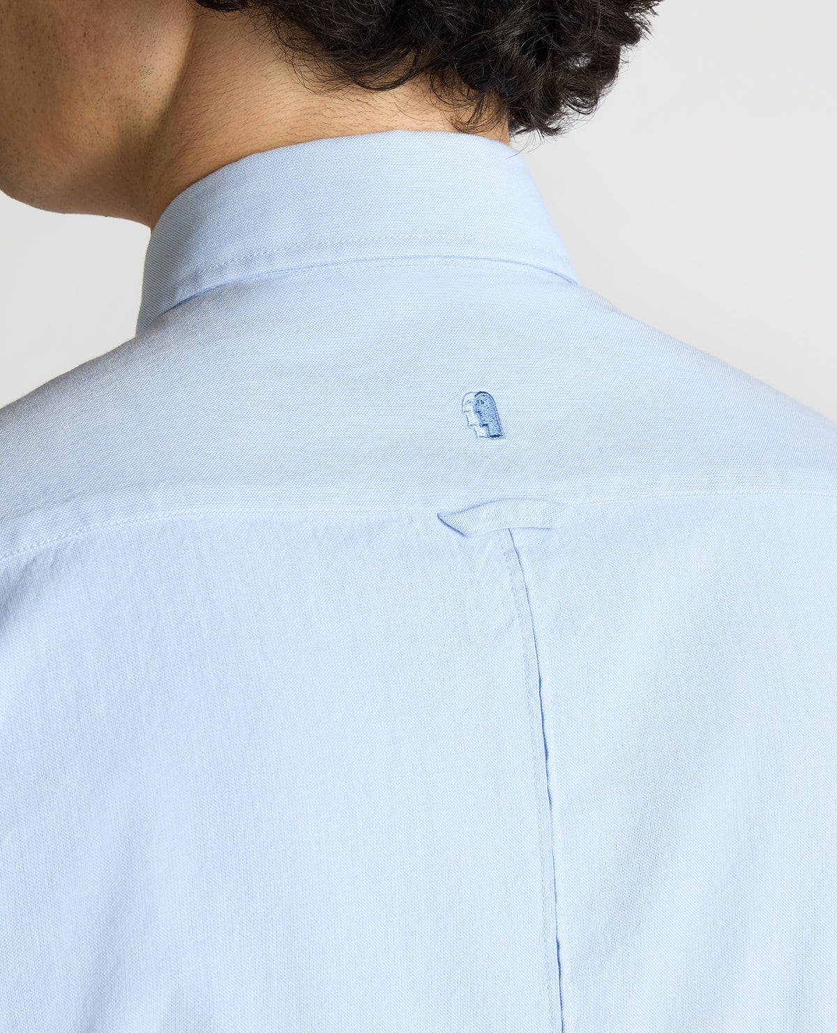 Man wearing a blue Slim Fit Cotton Oxford Shirt
